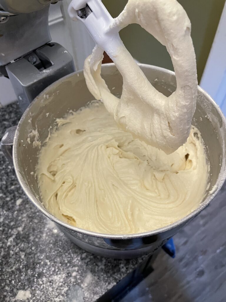 a well-beaten cake batter and an upright mixer paddle