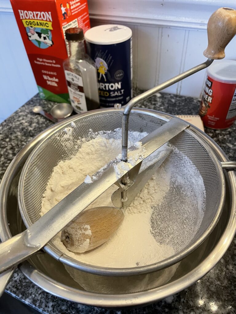 a flour sifter over a bowl